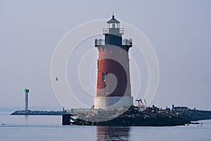 A red lighthouse in the Delaware Bay during the blue hour