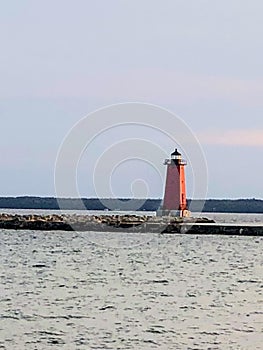 Red lighthouse in lake in Upper Michigan