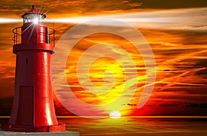 Red Lighthouse with Light Beam at Sunset