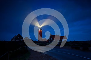 Lighthouse lightbeams in night