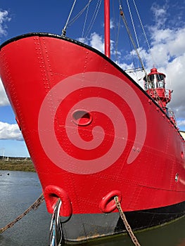 Red Lighthouse mounted atop a ship