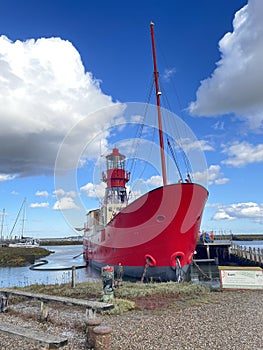 Red Lighthouse mounted atop a ship