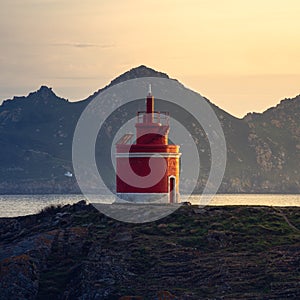 RED LIGHTHOUSE AT NIGHT IN CABO HOME, CANGAS, SPAIN