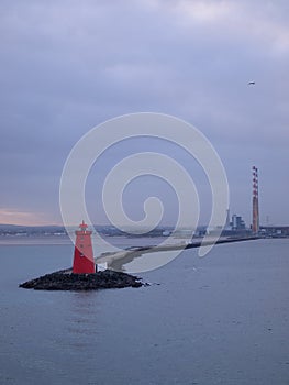 Red Lighthouse and Smoke Stacks in Dublin Harbor