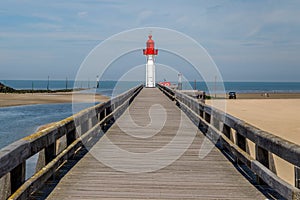 Red lighthouse in Trouville, famous resort in Normandy, France.