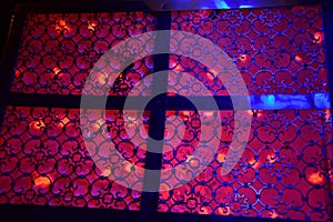 Red lighting and patterns on stage for the wedding