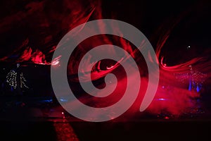 red lights illuminate the party