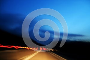 Red lights made from fast car in highway