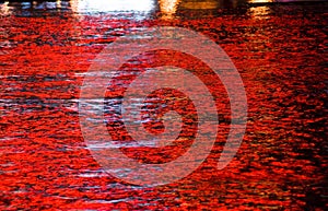 Red lights reflected in water