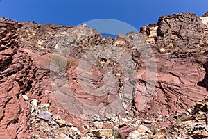 Red limestone and dolomite rock formations in Hajar Mountains on Arabian Peninsula, United Arab Emirates, Hatta