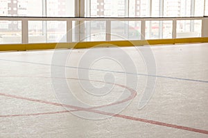 Red line on hockey rink. Face off circle. modern empty . Front view from ice