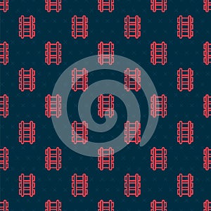 Red line Toy railway, railroad track icon isolated seamless pattern on black background. Vector