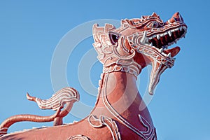 The red lion sculpture in the Buddhist temple in Thailand.