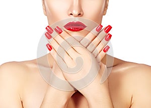 Red lips and bright manicured nails. open mouth. Beautiful manicure and makeup. Celebrate make up and clean skin