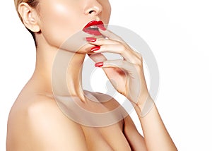 Red lips and bright manicured nails. open mouth. Beautiful manicure and makeup. Celebrate make up and clean skin