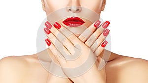 Red lips and bright manicured nails. open mouth. Beautiful manicure and makeup. Celebrate make up and clean skin