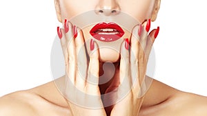 Red lips and bright manicured nails. open mouth. Beautiful manicure and makeup. Celebrate make up and clean skin