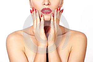 Red lips and bright manicured nails. open mouth. Beautiful manicure and makeup. Celebrate make up and clean skin