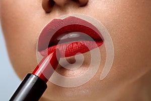 Red Lips. Closeup Of Woman Beauty Face With Bright Lipstick On