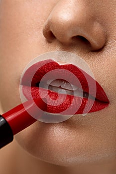 Red Lips. Closeup Of Woman Beauty Face With Bright Lipstick On