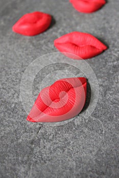 red lips on a dark gray background, juicy red lips. abstract background. Beautiful texture