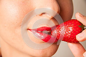 Red lips and delicious strawberry