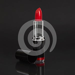 Red lipstick on black background