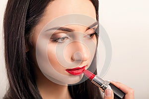 Red Lipstick. Closeup Of Woman Face With Bright Red Matte Lipstick On Full Lips. Beauty Cosmetics, Makeup Concept. High Resolution