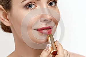 Red Lipstick. Closeup Of Woman Face With  Red Matte Lipstick On Full Lips. Beauty Cosmetics, Makeup