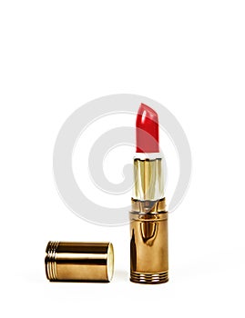 Red lipstick in golden packaging