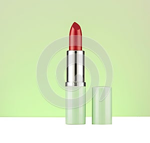 Red lipstick on green background