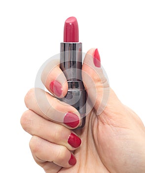 Red lipstick in hand with red nail polish on a white background