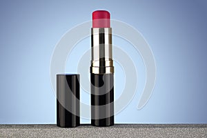 Red lipstick isolated on light blue gradient background