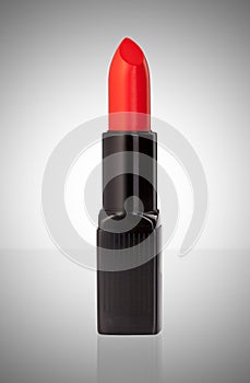 Red lipstick isolated on white background