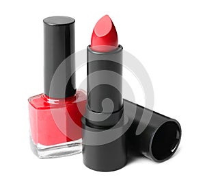 Red lipstick and nail polish on white background. Decorative cosmetics