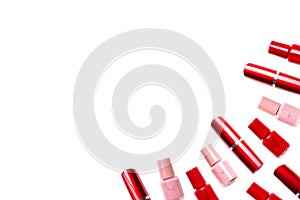 Red lipstick and nail polish on a white background. Isolated pattern