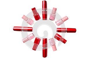 Red lipstick and nail polish on a white background. Isolated pattern