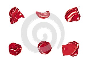 Red lipstick samples as beauty cosmetic texture isolated on white background, makeup smear or smudge as cosmetics