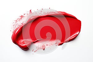Red lipstick smear. Sample of a red lipstick smudge on white background. Creamy makeup texture. A sample of a bright red