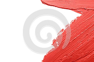 Red lipstick smears on white background, closeup.