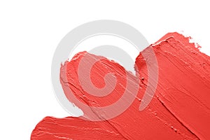 Red lipstick smears on white background, closeup.