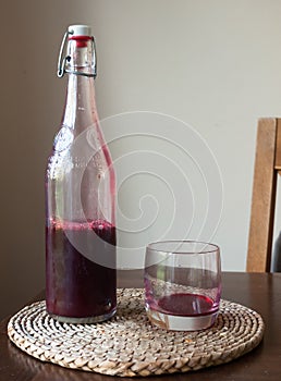 Red liquid glass bottle table fresh wild wine ruby