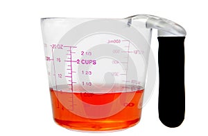 Red liquid in measuring cup