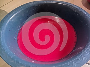 red liquid mixture in a bowl