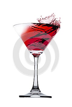 Red liquid splash in Martini glass