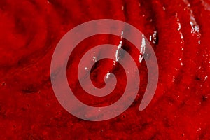 The red liquid, syrup making an abstract background