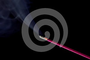 Red and lit Asian incense