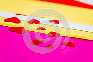 Red little hearts coming out from envelope isolated on pink background with copy space, loveletter concept