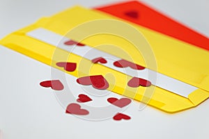 Red little hearts coming out from envelope isolated on white background with copy space, loveletter concept