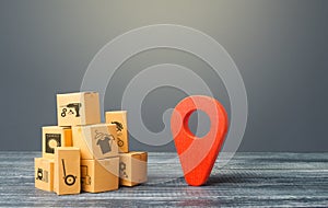 Red location pointer geolocation symbol and cardboard boxes. Global market and business, import and export. Distribution delivery